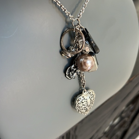 Long silver toned necklace with 8 charms in black and silver heart bead ring - Picture 2 of 9